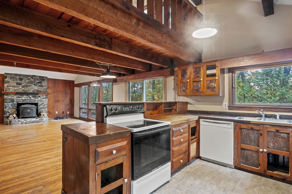 55 Putney Road Leverett, MA 01054 - Photo 8 of 40 a kitchen with stainless steel appliances granite countertop a stove and a sink