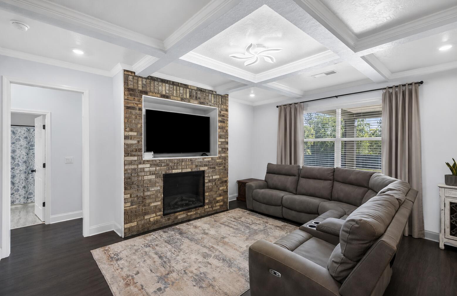 520 East Frontage Road Aiken, SC 29805 - Photo 14 of 47 a living room with furniture a flat screen tv and a fireplace