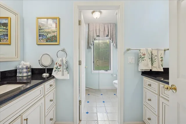 a view of bathroom with dual sinks
