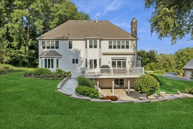 a front view of a house with a yard table and chairs