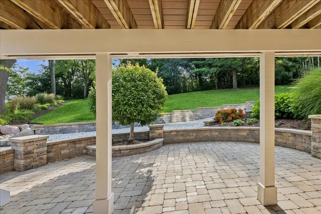 a view of house with backyard outdoor seating and green space