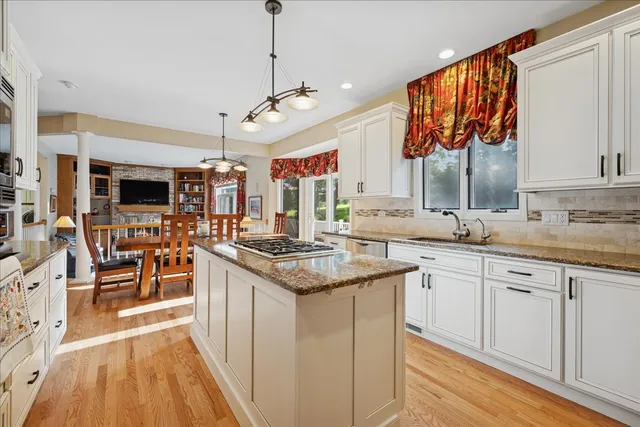 a kitchen with lots of counter top space and wooden floor