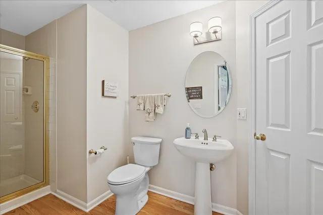 a bathroom with a toilet sink and shower