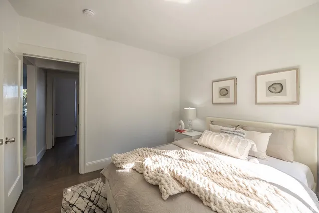 a bedroom with a bed and a view of bedroom