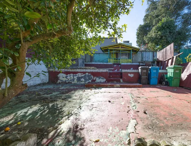 a front view of house with yard barbeque oven and outdoor seating