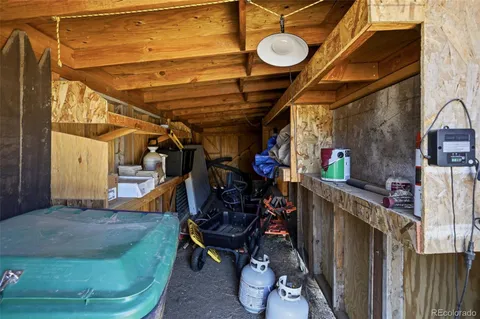 a view of a yard with yellow house