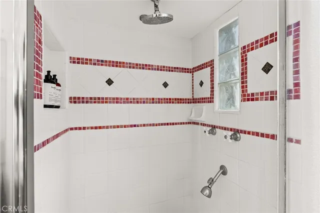 a view of a patio with table and chairs potted plants with wooden floor and fence