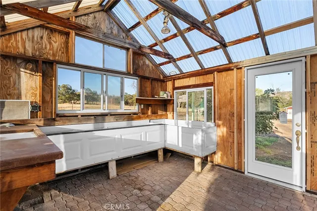 a view of large trees and a yard