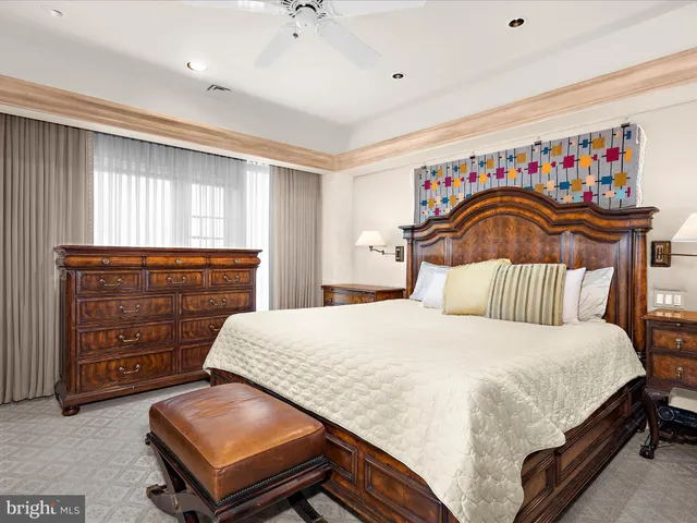 a bedroom with a bed and a dresser