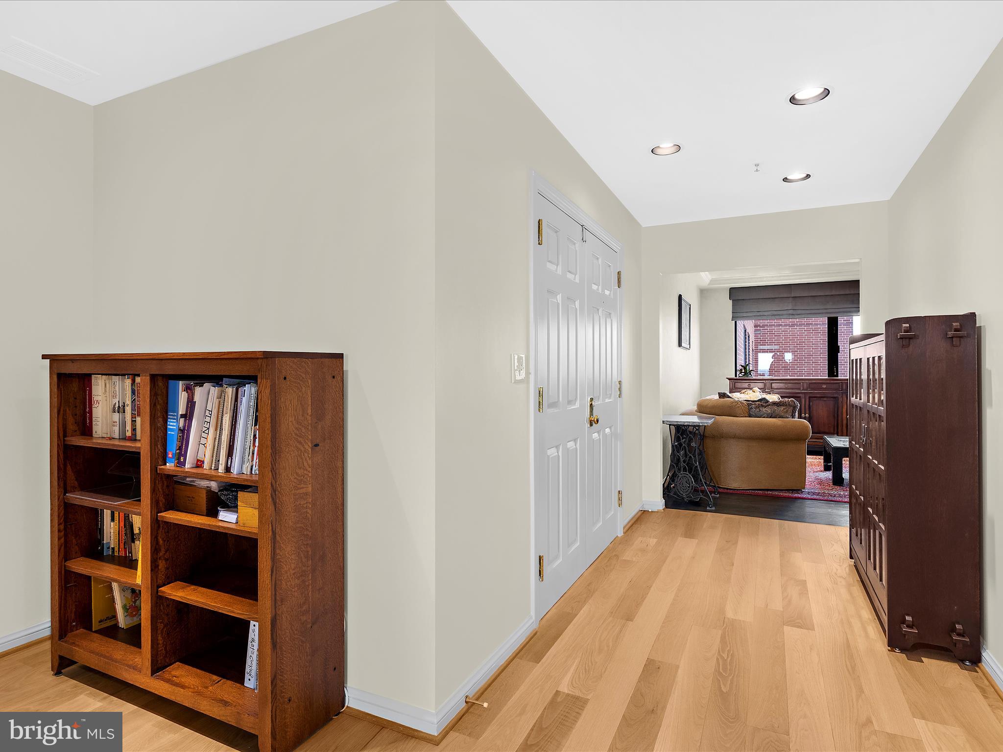 10 East Lee Street, Unit 2405 Baltimore, MD 21202 - Photo 26 of 50 a view of a kitchen with fridge and workspace