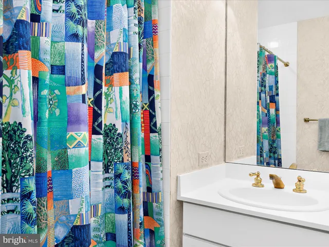 a bathroom with a shower curtain