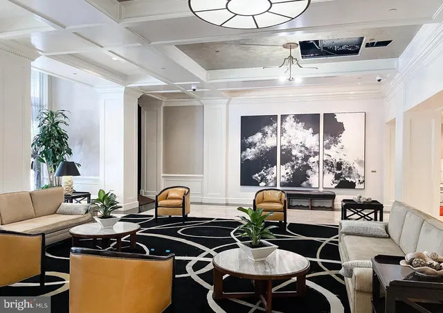 a view of a livingroom with furniture and kitchen
