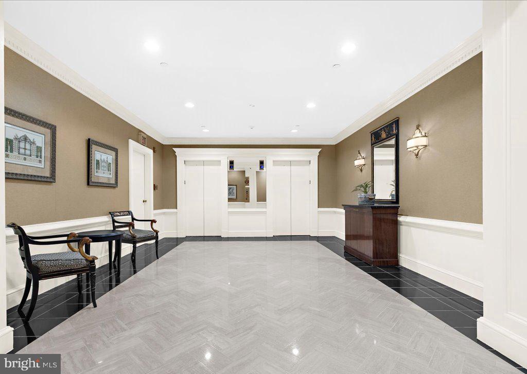 10 East Lee Street, Unit 2405 Baltimore, MD 21202 - Photo 34 of 50 a view of a livingroom with furniture and kitchen