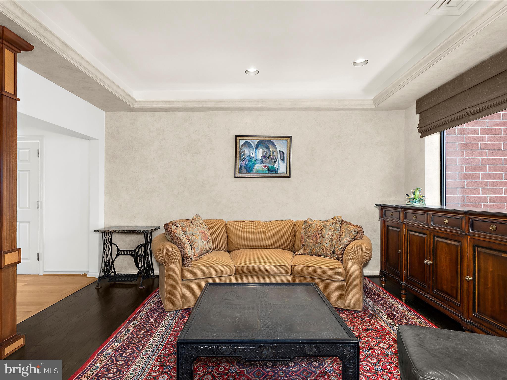 10 East Lee Street, Unit 2405 Baltimore, MD 21202 - Photo 6 of 50 a living room with furniture a rug and a window
