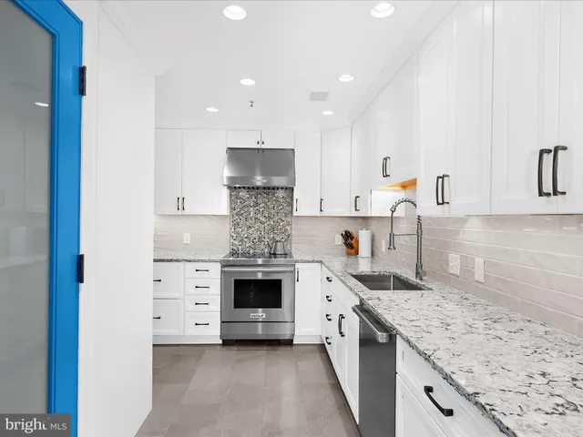 a kitchen with a stove and cabinets
