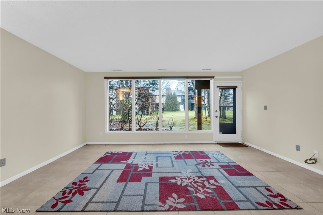 985 Canyon View Road, Unit 108D Northfield, OH 44067 - Photo 4 of 18 Empty room featuring light tile patterned floors