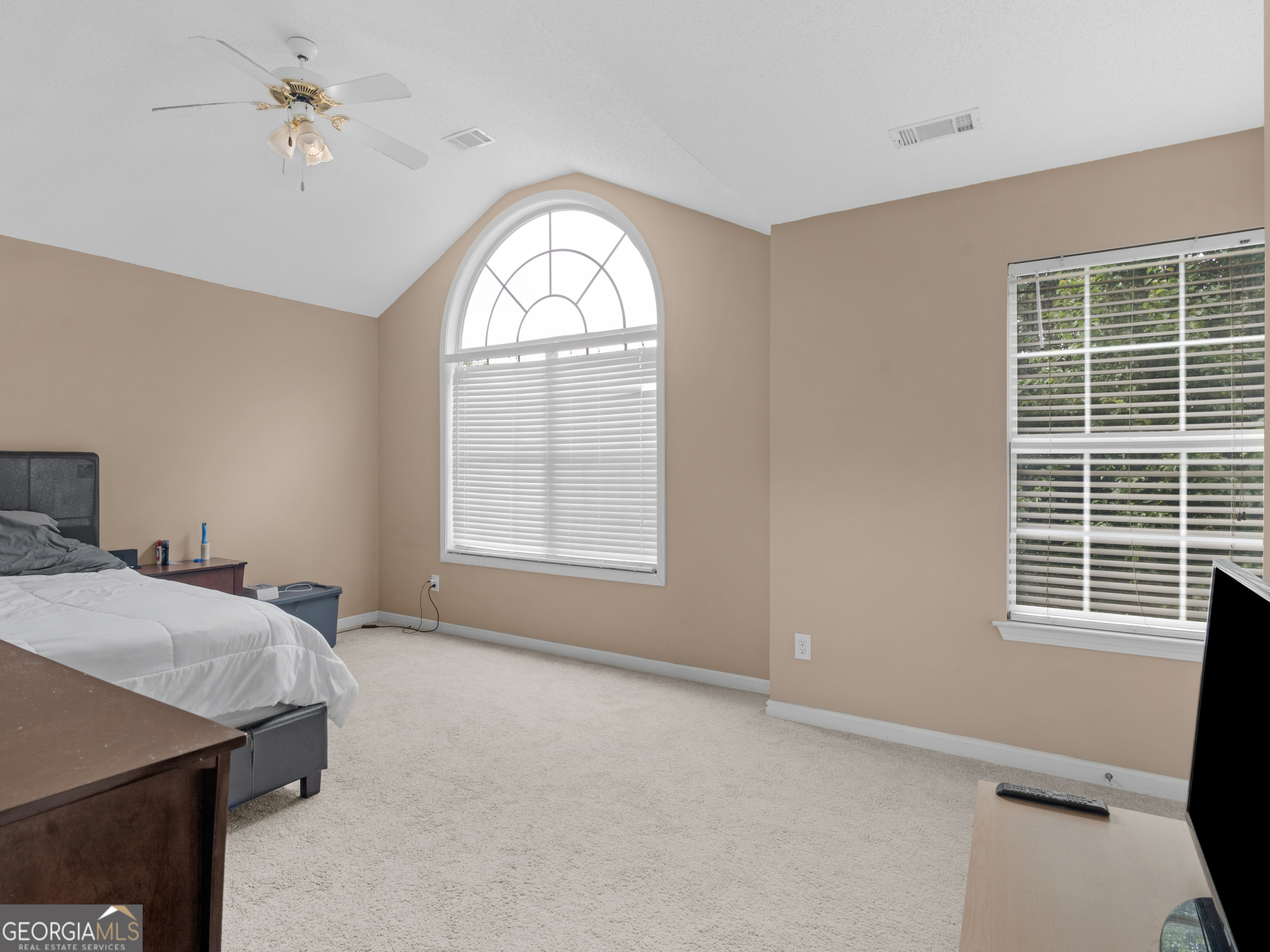 3370 Waggoner Place Rex, GA 30273 - Photo 17 of 25 a bedroom with a bed dresser and a window