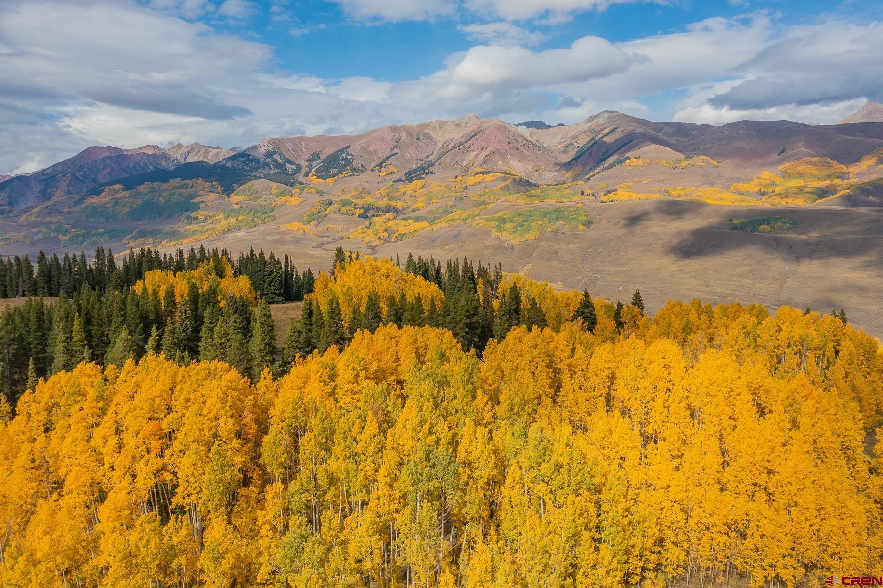 E31 Prospect Drive Crested Butte, CO 81225 - Photo 14 of 26 a view of a lake with a mountain in the background