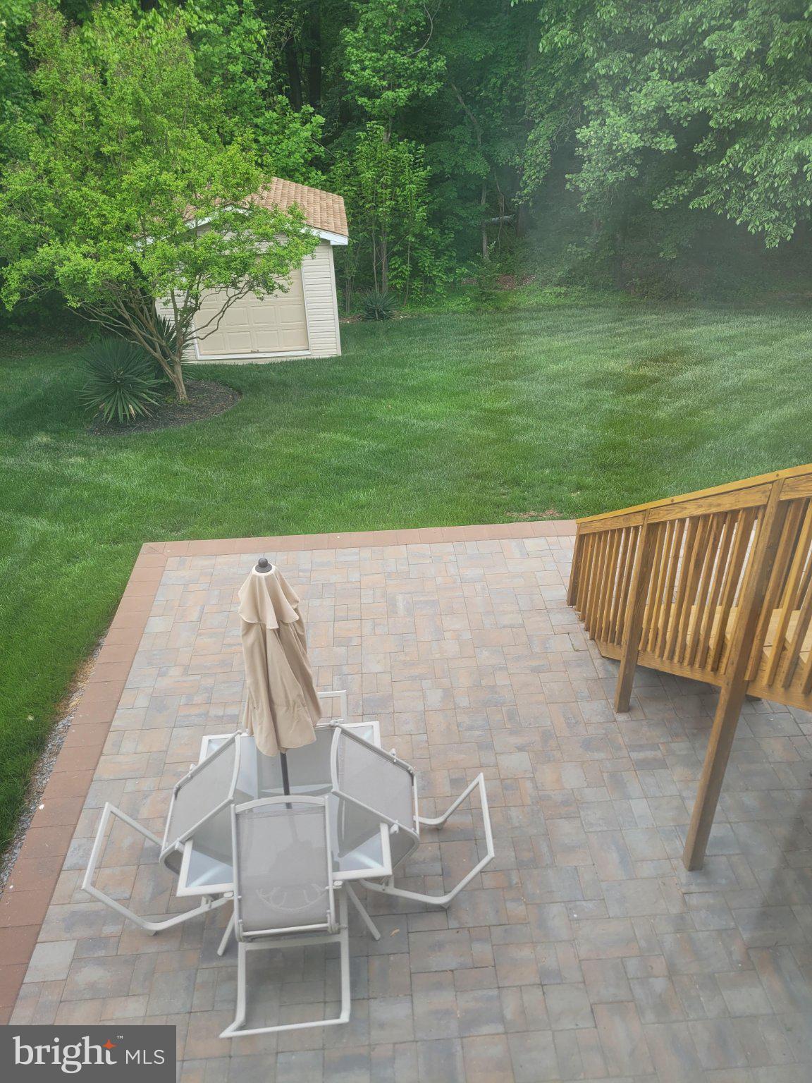 1202 Strausberg Street Accokeek, MD 20607 - Photo 14 of 43 Serene backyard retreat with patio.