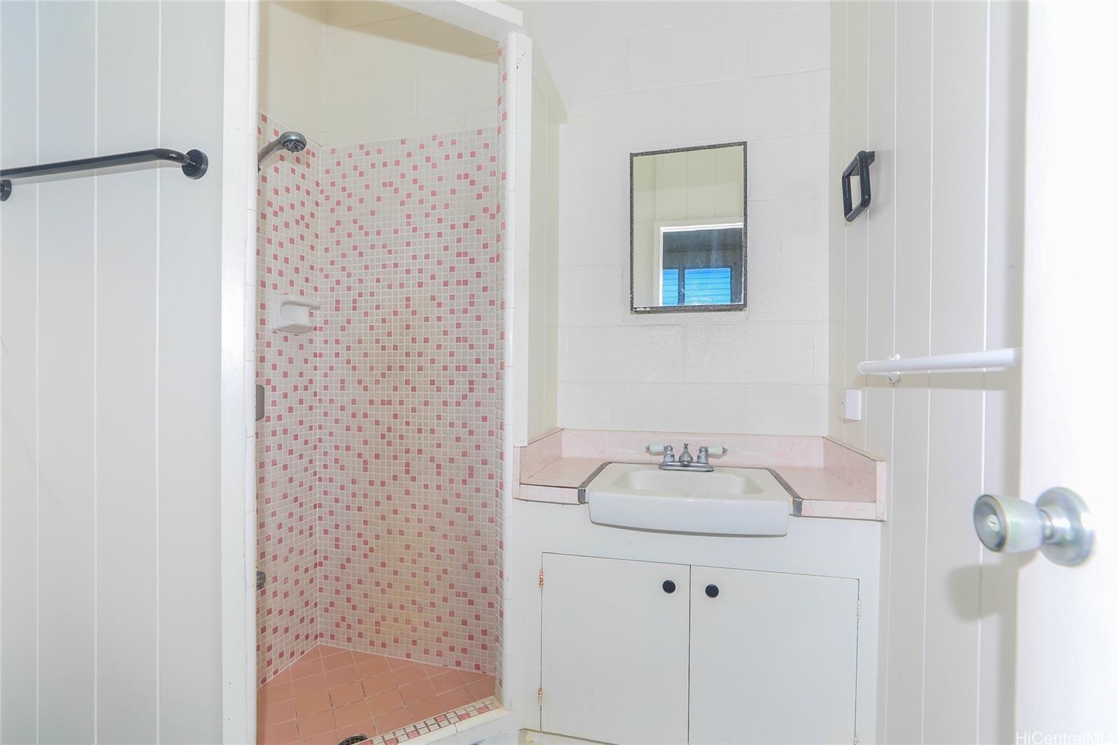 1952 Nehoa Place Honolulu, HI 96822 - Photo 16 of 25 a white bath tub sitting next to a white sink