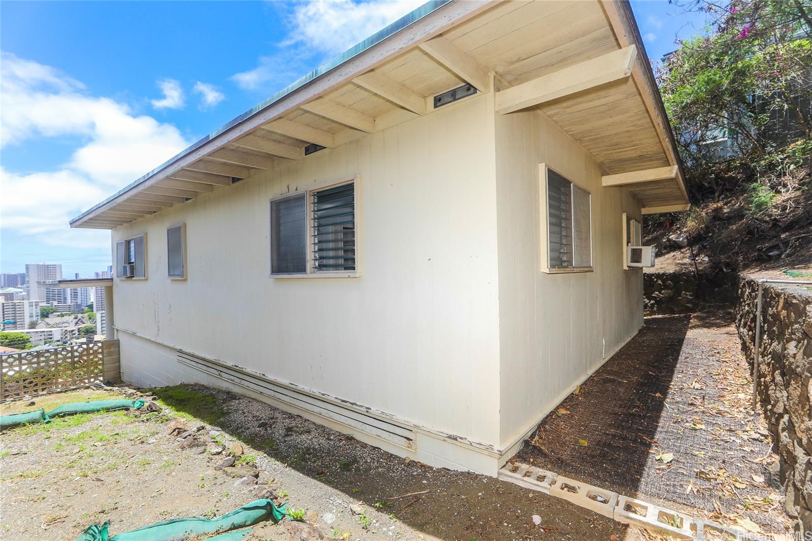 1952 Nehoa Place Honolulu, HI 96822 - Photo 22 of 25 a front view of a house with trees