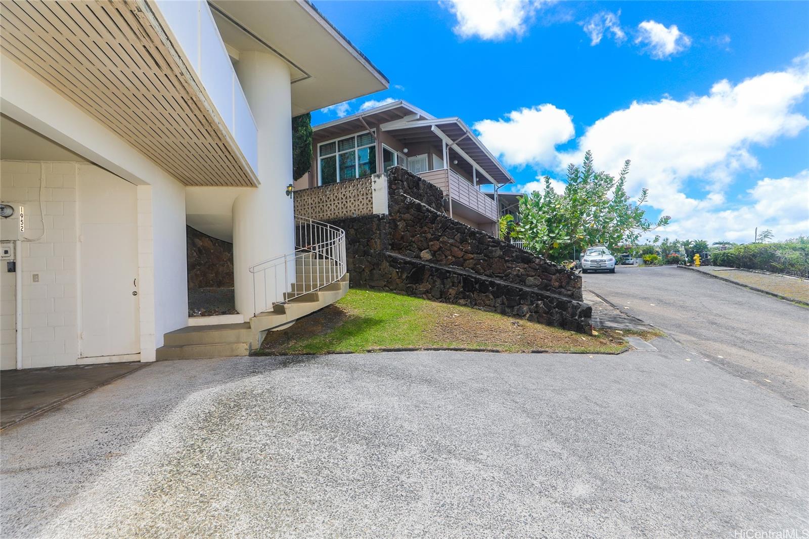 1952 Nehoa Place Honolulu, HI 96822 - Photo 24 of 25 a view of a house with a backyard and a garage