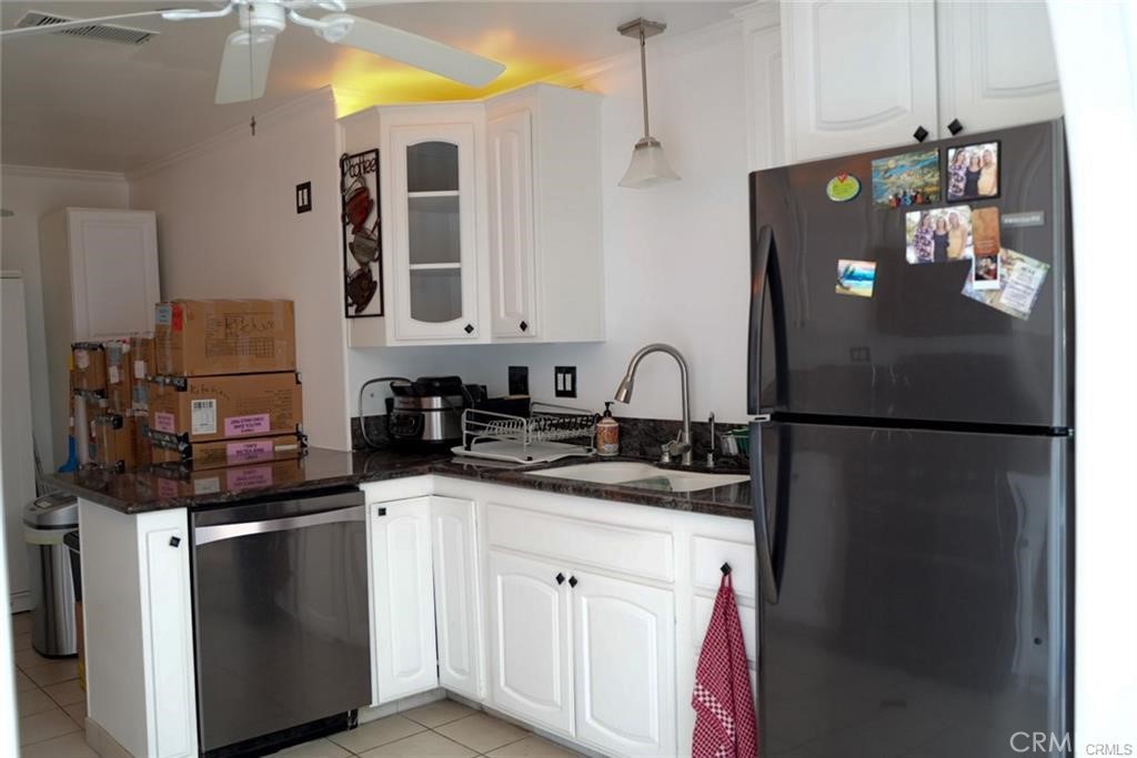 15980 Filbert Street Sylmar, CA 91342 - Photo 6 of 17 a kitchen with stainless steel appliances granite countertop a refrigerator and a sink