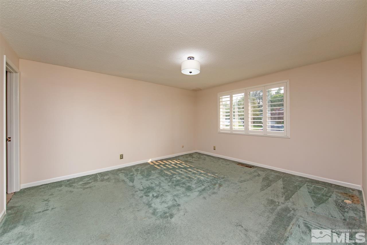 4095 Warren Way Reno, NV 89509 - Photo 11 of 17 an empty room with a window
