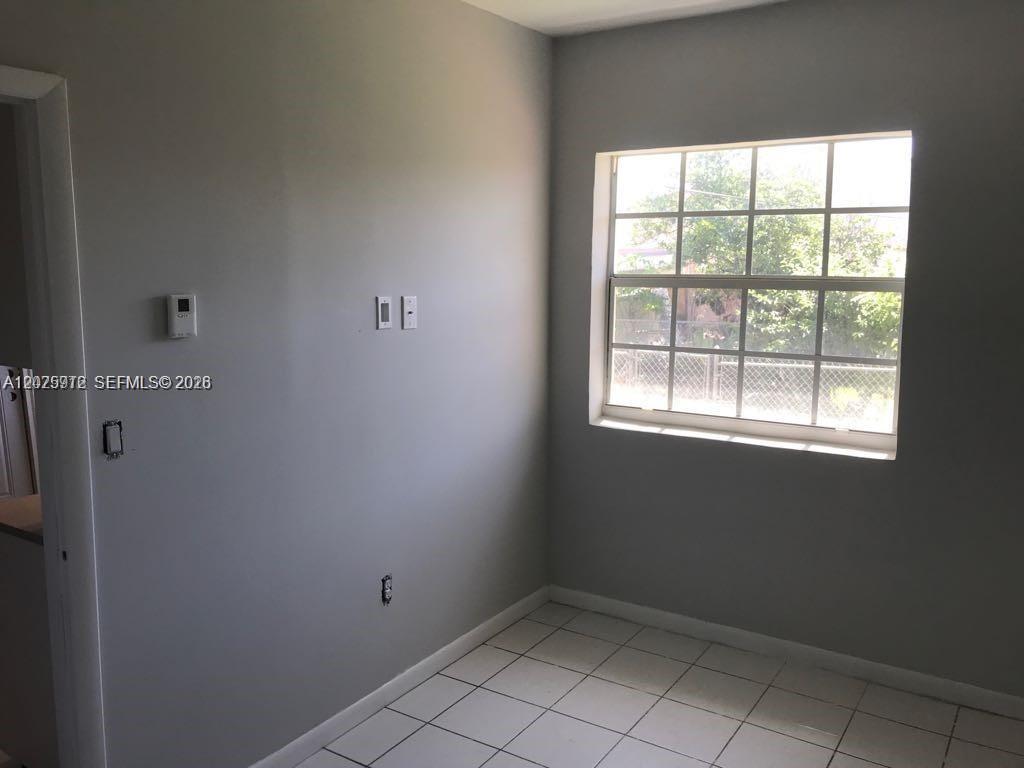 2224 Southwest 11th Street, Unit 3 Miami, FL 33135 - Photo 7 of 15 a view of an empty room with a window