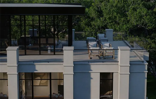 a view of a balcony with chairs