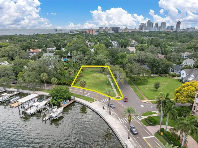 a view of a lake with a yard