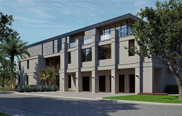 a front view of building with a garden