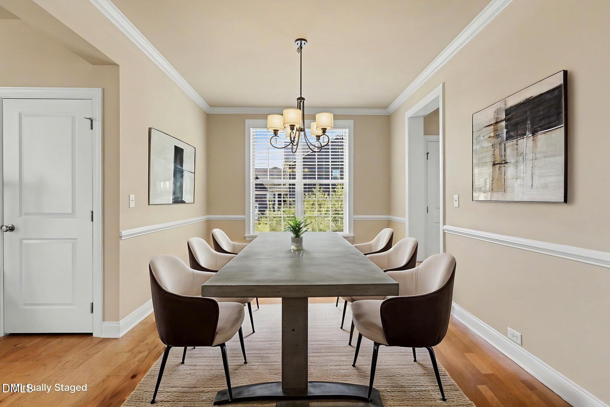 351 Gartrell Way Cary, NC 27519 - Photo 13 of 51 a dining room with furniture window and wooden floor