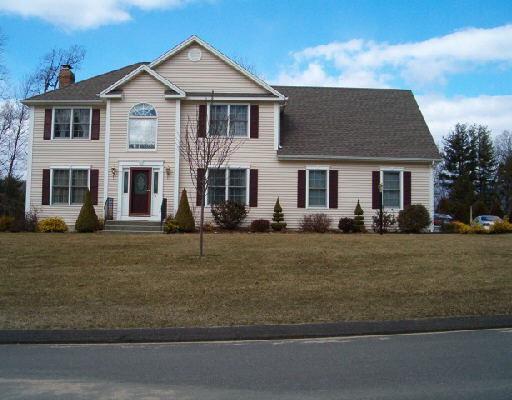 2 Sterling Ridge Shelton, CT 06484 - Photo 1 of 1 a front view of a house with a yard