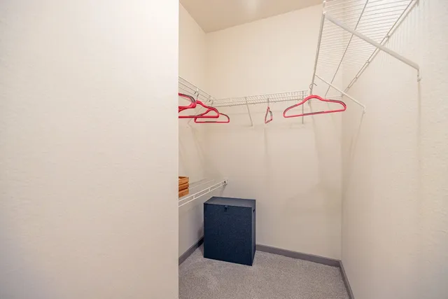 a dining room with furniture and a wooden floor