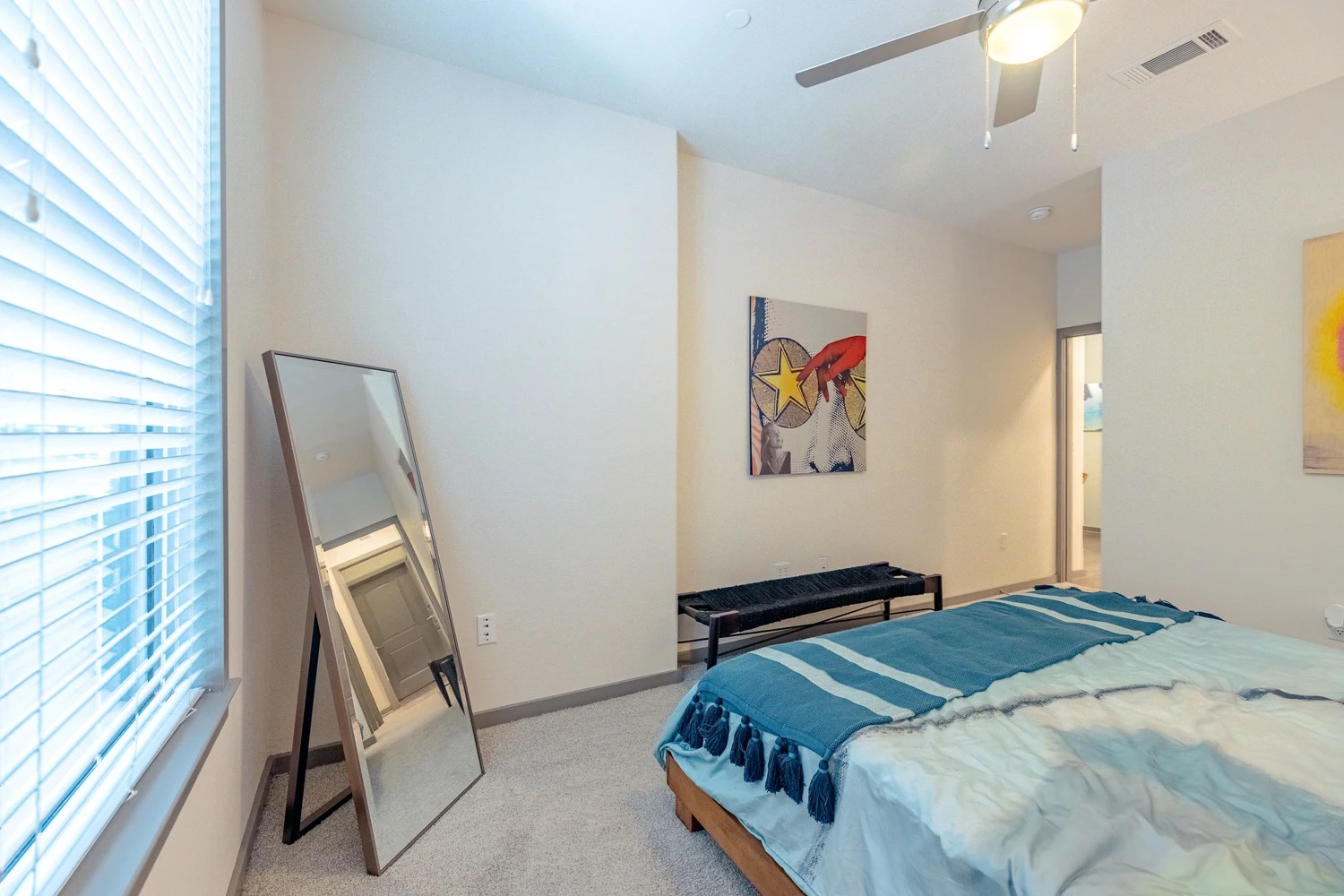 8515 Interstate 35, Unit 9106 Austin, TX 78744 - Photo 4 of 24 a bedroom with a bed and a chandelier