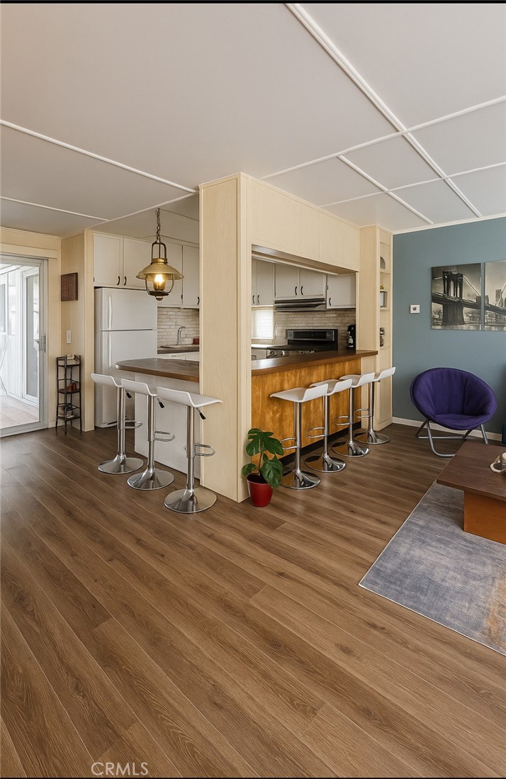 69510 Parkside Drive Desert Hot Springs, CA 92241 - Photo 2 of 5 a living room with furniture and wooden floor
