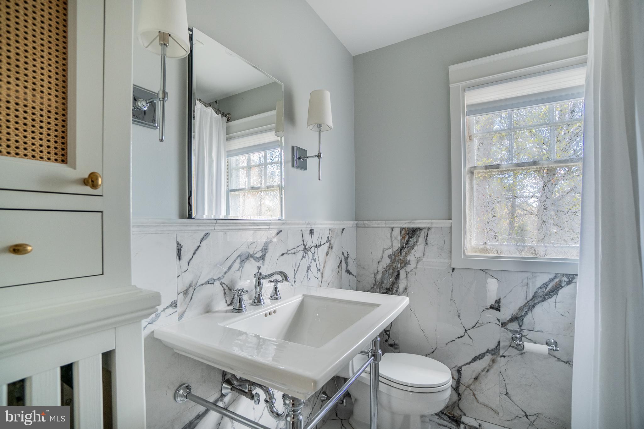 684 North Chester Road Swarthmore, PA 19081 - Photo 14 of 21 a bathroom with a sink toilet a mirror and shower