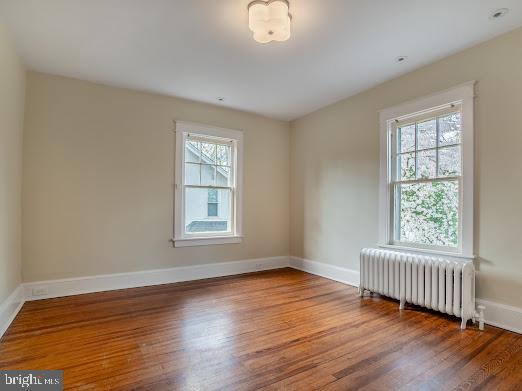 684 North Chester Road Swarthmore, PA 19081 - Photo 15 of 21 a view of an empty room with wooden floor and a window