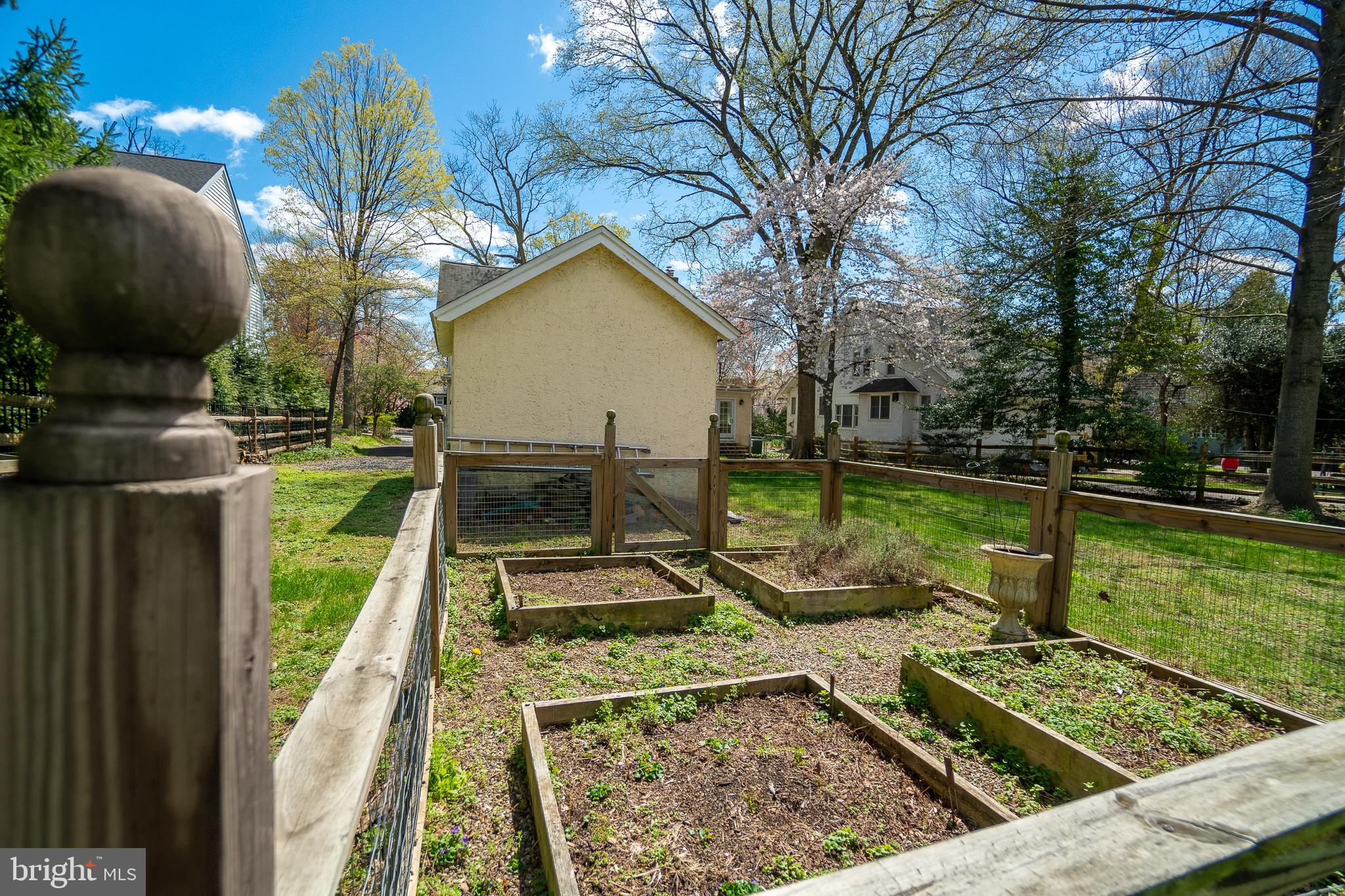 684 North Chester Road Swarthmore, PA 19081 - Photo 20 of 21 a view of a wooden deck with chairs and a yard