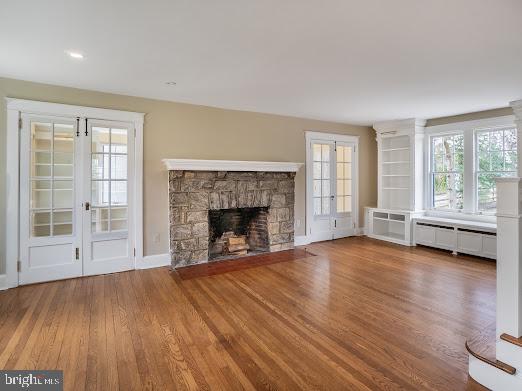 684 North Chester Road Swarthmore, PA 19081 - Photo 6 of 21 a view of empty room with wooden floor and fireplace
