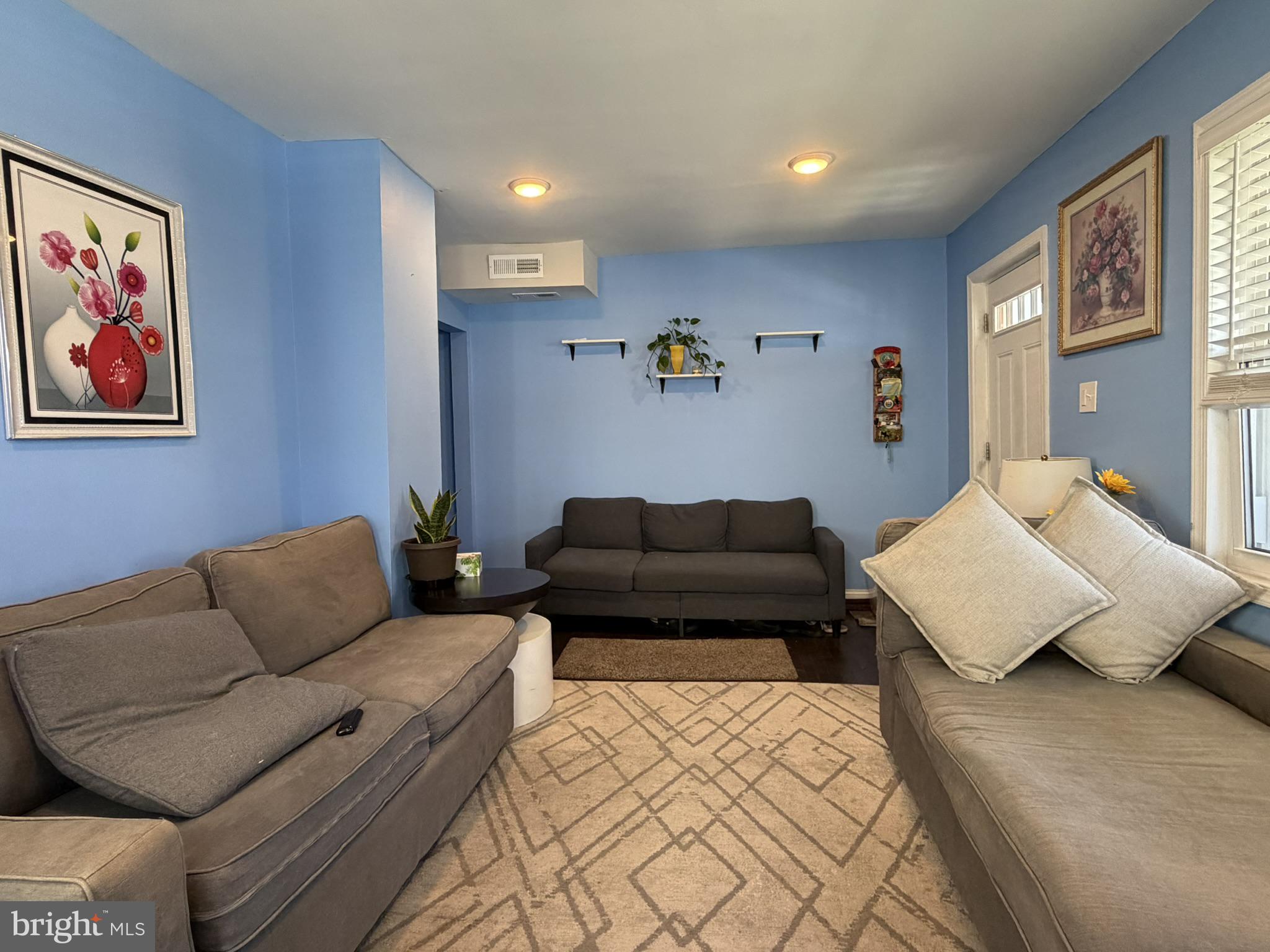 203 Sollers Point Road Dundalk, MD 21222 - Photo 2 of 16 Charming blue-hued living space.