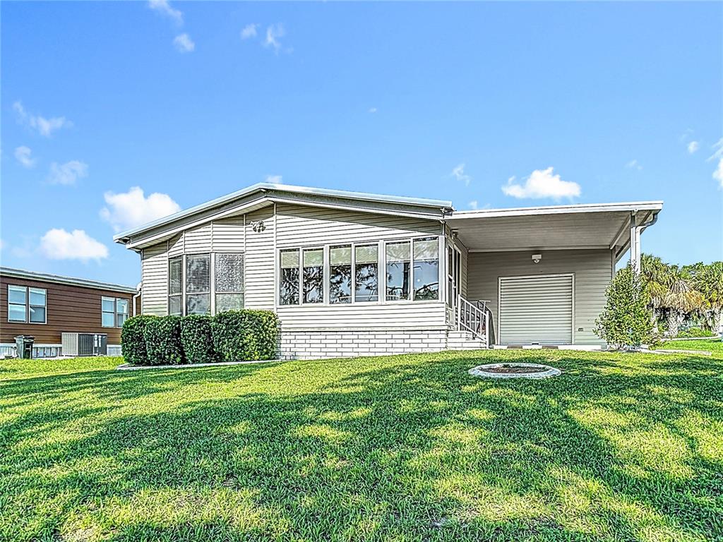 14761 Rialto Avenue Brooksville, FL 34613 - Photo 21 of 23 a view of house with backyard