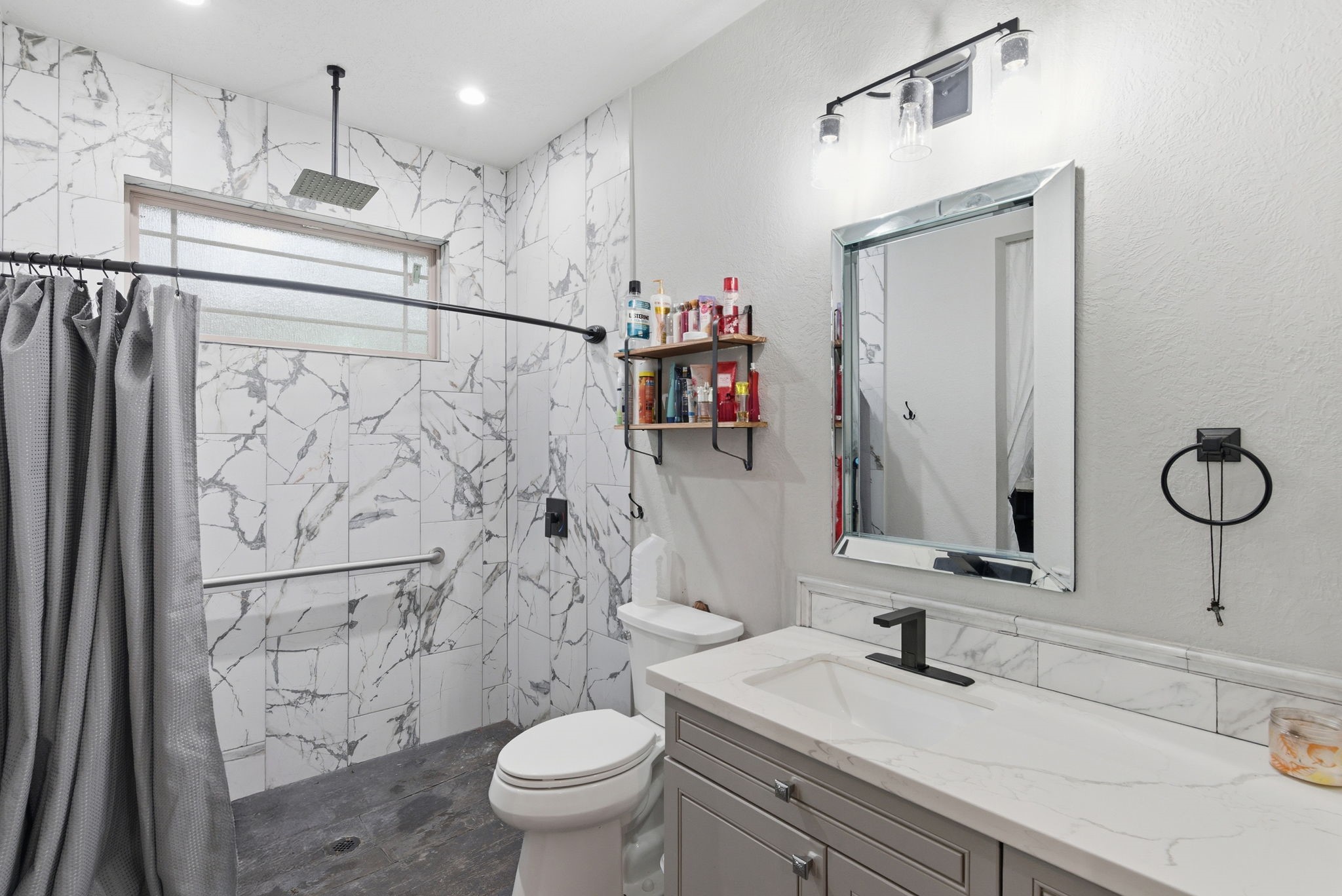1480 Traylor Road Conroe, TX 77304 - Photo 15 of 25 a bathroom with a sink a toilet and shower