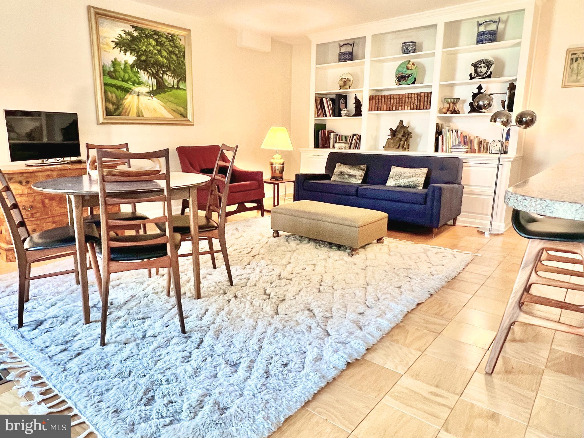520 N Street Southwest, Unit S232 Washington, DC 20024 - Photo 2 of 2 a living room with furniture and a flat screen tv