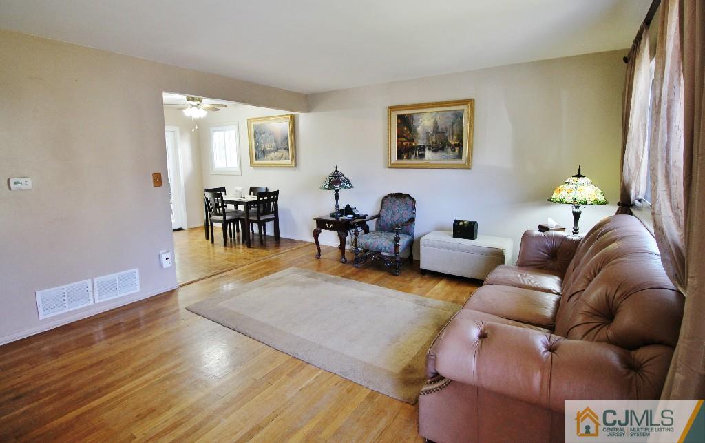 197 North Hill Road Colonia, NJ 07067 - Photo 14 of 25 a living room with furniture and wooden floor