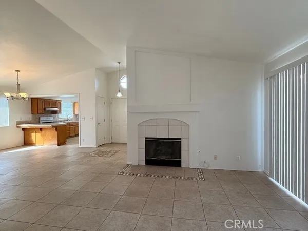 a view of a kitchen with a sink and a fireplace