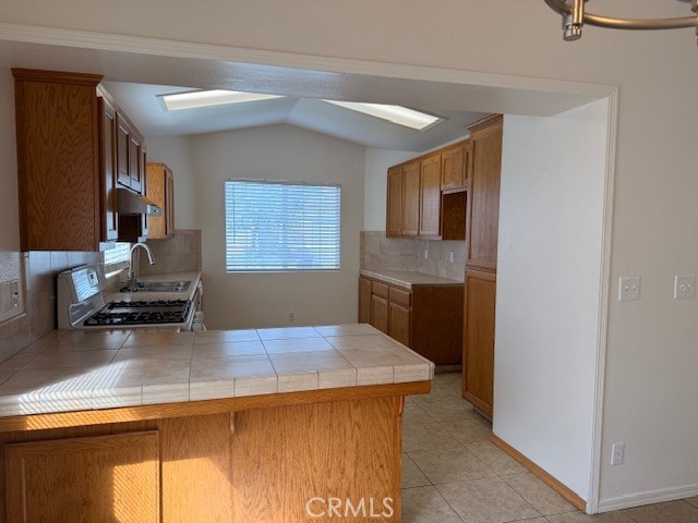 518 5th Santa Maria, CA 93458 - Photo 6 of 24 a kitchen with a stove and a refrigerator