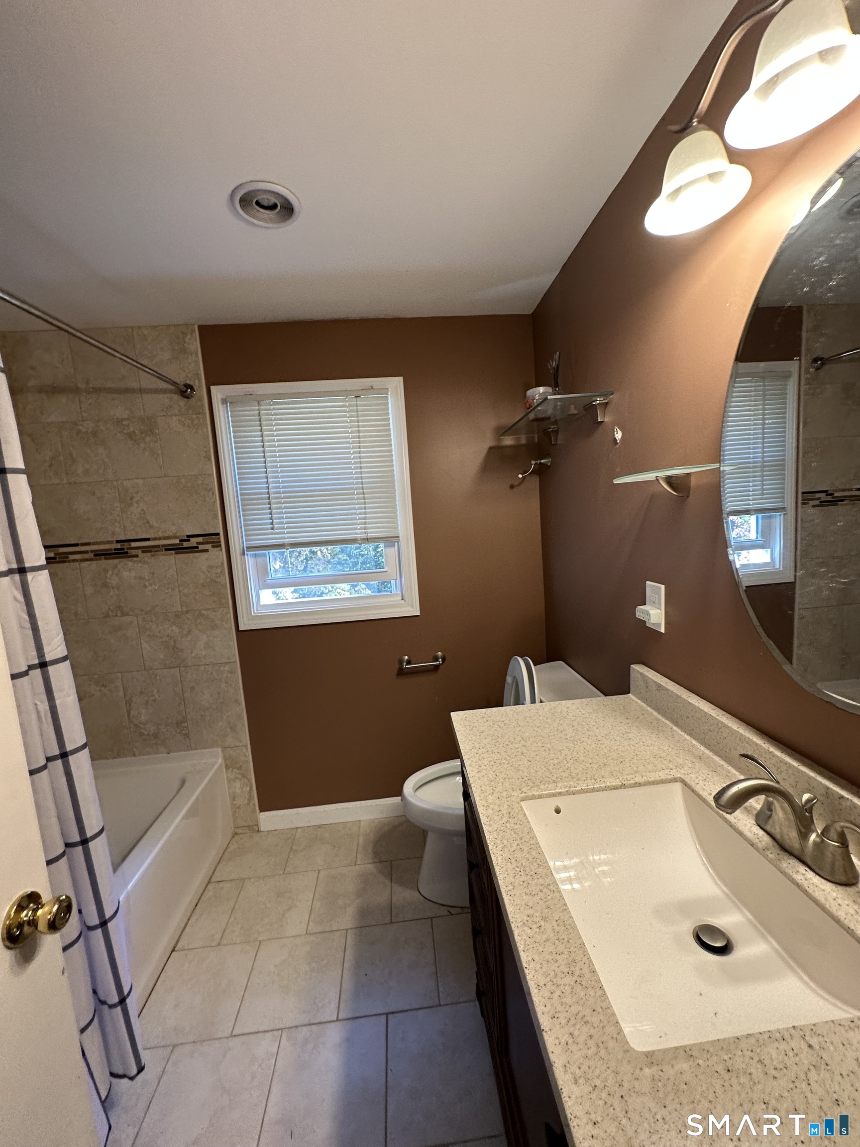 26 South Glenwoods Road Ledyard, CT 06335 - Photo 11 of 12 a bathroom with a sink a toilet and mirror