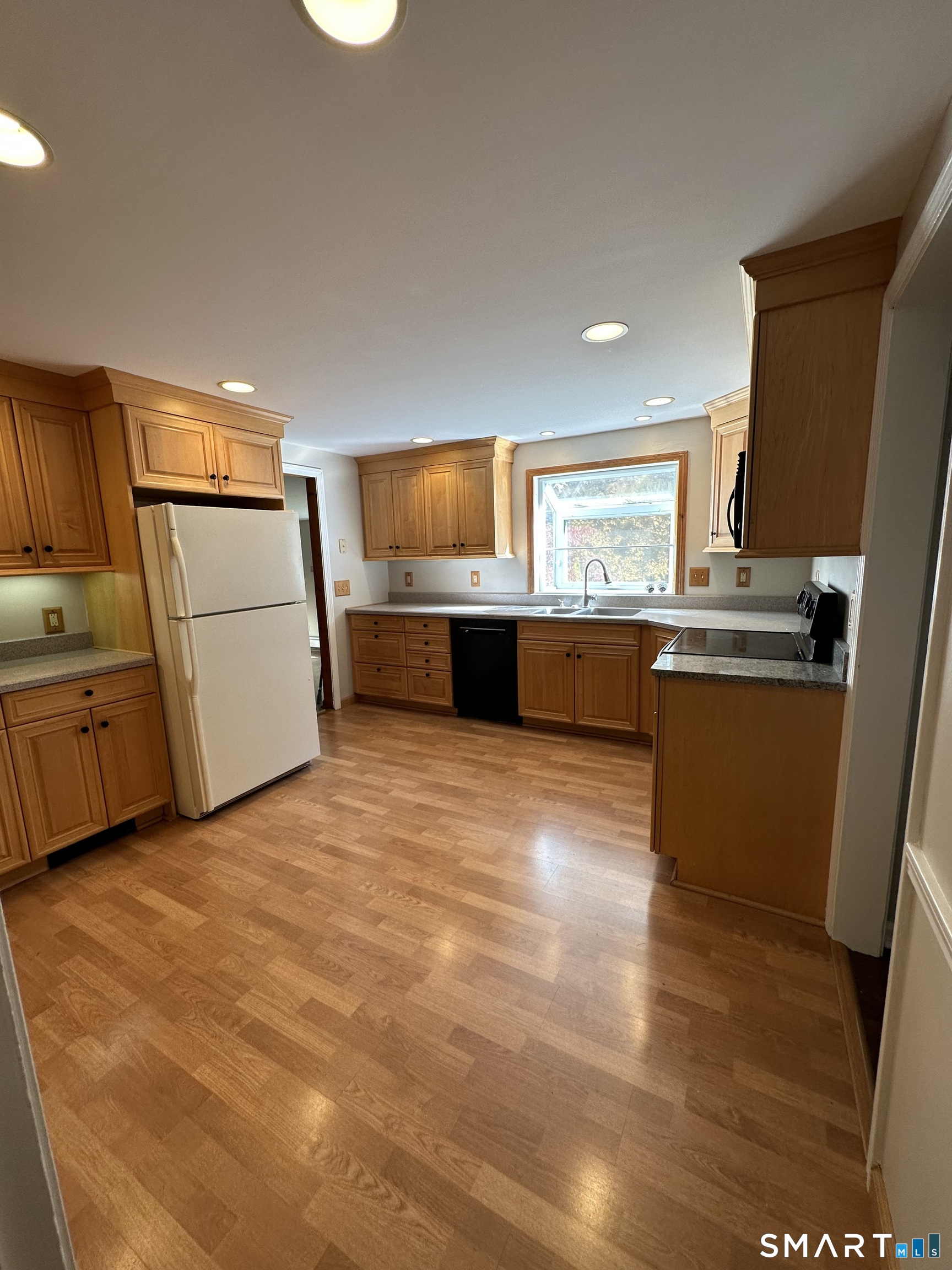 26 South Glenwoods Road Ledyard, CT 06335 - Photo 3 of 12 a kitchen with stainless steel appliances a refrigerator a sink appliances and a counter